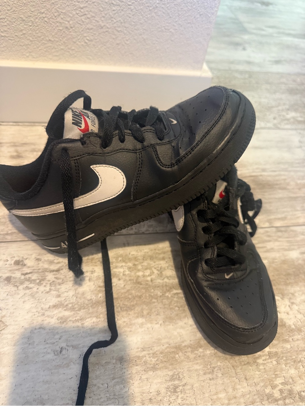 Nike Kids Black Sneakers with White Swoosh